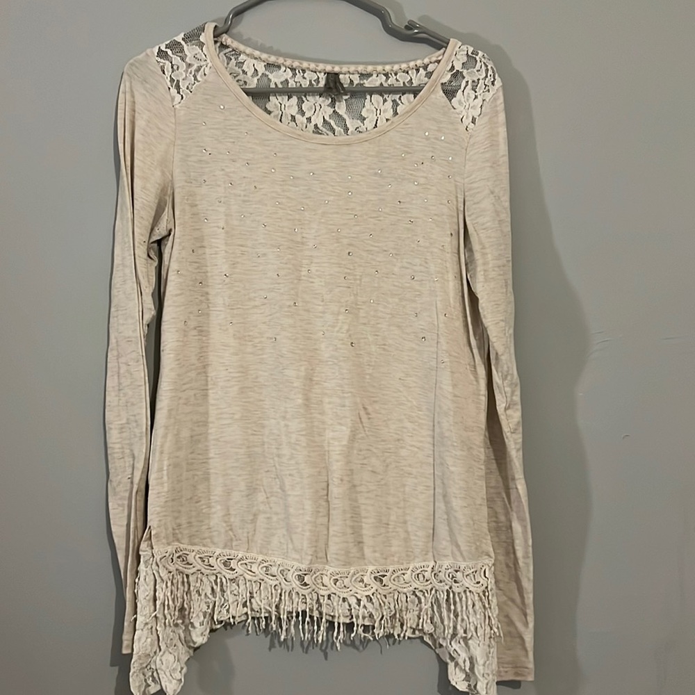 Medium cream top. Long sleeve with gems and lace